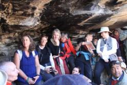 Pilgrims listening to recollections and looking at Jetsunma's photographs of her time in the cave